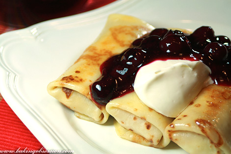 Curd Cheese Filled Crêpes with Blueberry Sauce