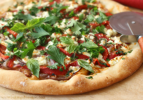 Roasted Garlic and Sun-Dried Tomato Pizza with Roasted Onions, Red Peppers and Feta
